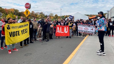 Chris Smalls, right, the head of the Amazon Labor Union, speaks to Amazon workers and supporters at a rally in Castleton-On-Hudson, N.Y., Oct. 10, 2022.