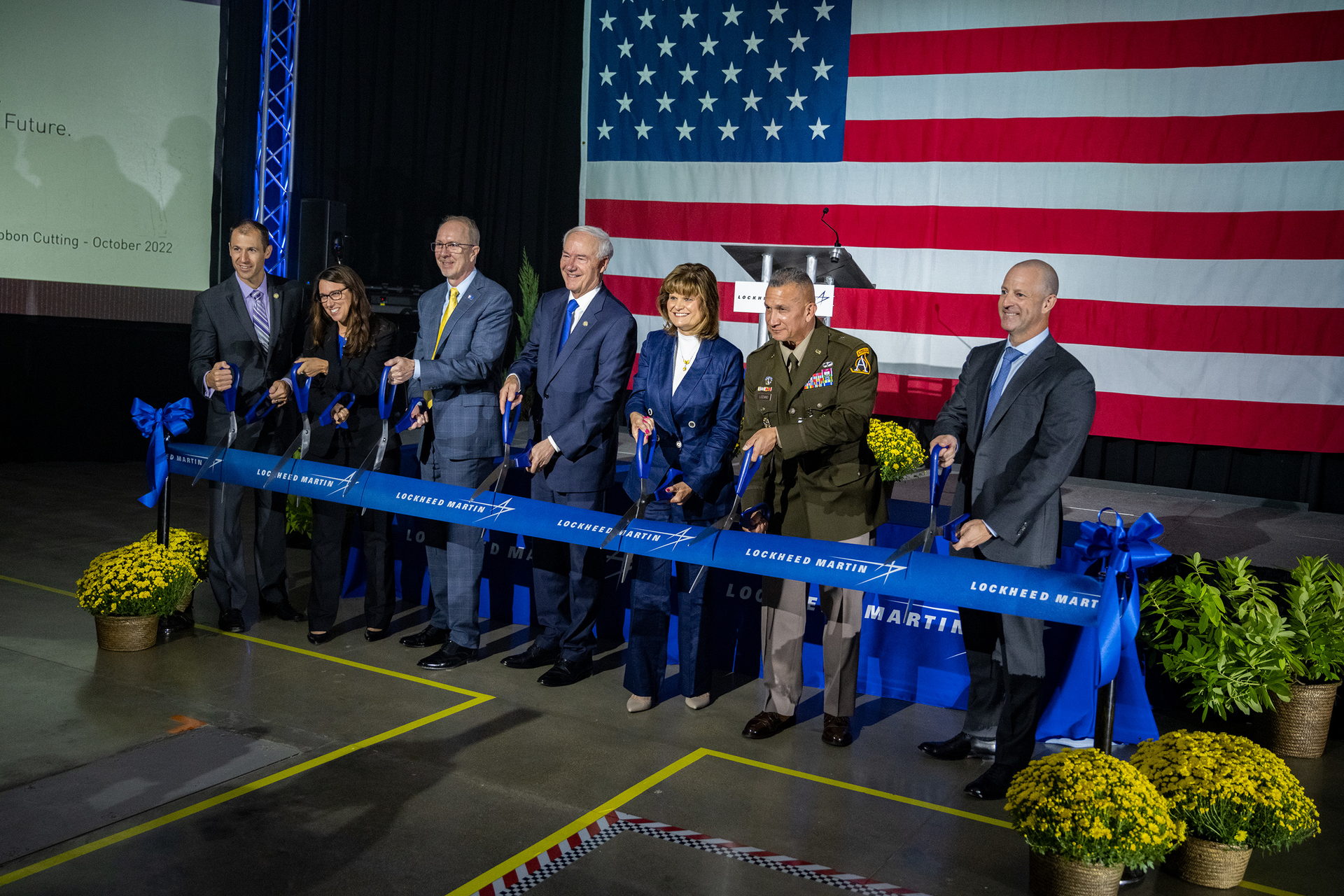 From Left, Mike Preston, Arkansas Commerce Secretary; Jen McManus, Vice President Of Production Operations, Lockheed Martin; Scott Greene, Executive Vice President, Missiles and Fire Control, Lockheed Martin; Arkansas Governor Asa Hutchinson; Brenda Davidson, Vice President Of PAC-3 Programs, Lockheed Martin; Brigadier General Frank J. Lozano, Program Executive Officer, Missiles and Space; and Aaron Huckaby, Camden Site Director, Lockheed Martin.