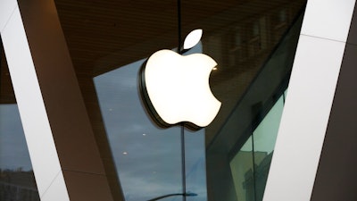 In this Saturday, March 14, 2020 file photo, an Apple logo adorns the facade of the downtown Brooklyn Apple store in New York. Workers at an Apple store in Oklahoma City voted to unionize, marking the second unionized Apple store in the U.S. in a matter of months, according to the federal labor board. The vote on Friday, Oct. 14, 2022, signaled another win for the labor movement, which has been gaining momentum since the pandemic.