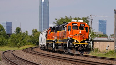 A BNSF locomotive heads south out of Oklahoma City, Wednesday, Sept. 14, 2022. A fifth rail union has approved its deal with the freight railroads to secure 24% raises and $5,000 in bonuses and a sixth one is set to vote Thursday. But all 12 rail unions must ratify their contracts to prevent a strike.