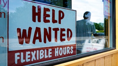 Help wanted sign is displayed in Deerfield, Ill., Wednesday, Sept. 21, 2022. The number of available jobs in the U.S. plummeted in August compared with July, a sign that businesses may pull back further on hiring and potentially cool chronically high inflation. There were 10.1 million advertised jobs on the last day of August, the government said Tuesday, Sept. 4, down a huge 10% from 11.2 million openings in July. In March, job openings had hit a record of nearly 11.9 million.
