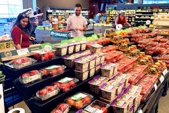 Shoppers shop at a grocery store in Glenview, Ill., Monday, July 4, 2022. Consumers spent a bit more in August than the previous month, a sign the economy is holding up even as inflation lifts prices for food, rent, and other essentials. Americans boosted their spending at stores and for services such as haircuts by 0.4% in August, after it fell 0.2% in July, the Commerce Department said Friday Sept. 30.