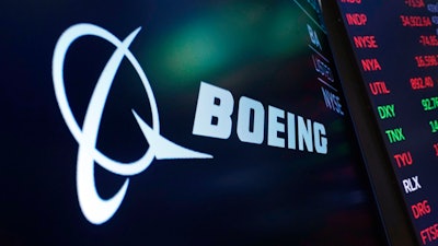 The logo for Boeing appears on a screen above a trading post on the floor of the New York Stock Exchange, Tuesday, July 13, 2021.
