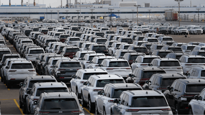 New vehicles are shown parked in storage lots near the the Stellantis Detroit Assembly Complex in Detroit, Wednesday, Oct. 5, 2022.