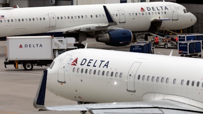 A Delta Air Lines plane leaves the gate on July 12, 2021, at Logan International Airport in Boston.