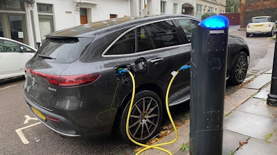 An electric vehicle charges at a public fast-charging station in London on Oct. 20, 2022.