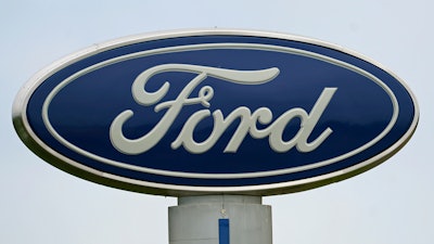 A Ford logo is seen on signage at Country Ford in Graham, N.C., on July 27, 2021.