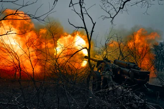 Ukrainian soldiers fire an artillery at Russian positions near Bakhmut, Donetsk region, Ukraine, Sunday, Nov. 20, 2022.