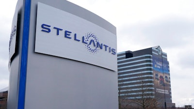 In this Tuesday, May 6, 2014, file photo, a vehicle moves past a sign outside Fiat Chrysler Automobiles world headquarters in Auburn Hills, Mich. The European Union’s top court has overturned a decision, Tuesday, Nov. 8, 2022, requiring automaker Fiat Chrysler to pay up to 30 million euros ($30 million) in back taxes to Luxembourg. The European Commission, the EU’s anti-trust regulator, had determined in 2015 that a Luxembourg tax ruling favored Fiat companies in Europe and was incompatible with state aid rules in the 27-nation bloc.