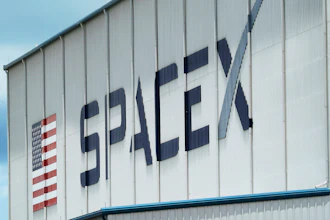 The SpaceX logo is displayed on a building, Tuesday, May 26, 2020, at the Kennedy Space Center in Cape Canaveral, Fla.
