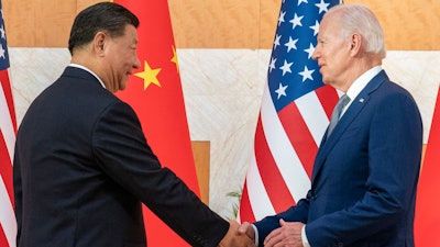 U.S. President Joe Biden, right, and Chinese President Xi Jinping shake hands before a meeting on the sidelines of the G20 summit meeting, on Nov. 14, 2022, in Bali, Indonesia