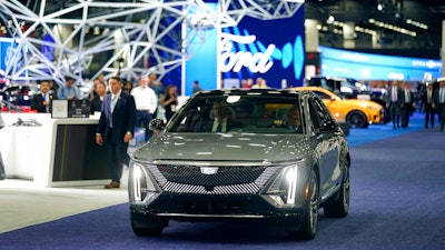 President Joe Biden drives a Cadillac Lyriq through the show room during a tour at the Detroit Auto Show, Wednesday, Sept. 14, 2022, in Detroit. About 900 workers at the new plant near Warren, Ohio, are the first to decide on union representation at a battery plant. The union says in a statement Friday, Dec. 9, that workers voted 710 to 16 for the UAW, a decision that is crucial to the future of the 372,000-member union.