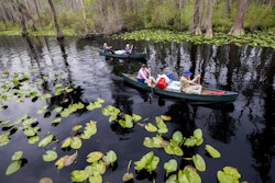 A group of visitors return to Stephen C. Foster State Park after an overnight camping trip on the Red Trail in the Okefenokee National Wildlife Refuge on April 6, 2022, in Fargo, Ga. A member of President Joe Biden's cabinet urged Georgia officials in a letter dated Nov. 22, 2022, to deny permits for a proposed mine near the edge of the famed Okefenokee Swamp and its vast wildlife refuge, saying the plan poses “unacceptable risk” to the swamp's fragile ecology.