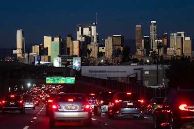 Traffic moves along the 110 Freeway in Los Angeles on Nov. 22, 2022. Fuel economy for 2021 model year vehicles in the U.S. stayed flat with 2020, as people continued to buy less-efficient trucks and SUVs, according to an annual government report published Monday, Dec. 12, 2022.