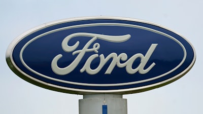 A Ford logo is seen on signage at Country Ford in Graham, N.C., on July 27, 2021.