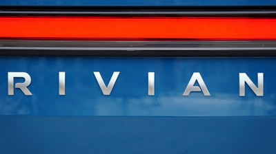 A Rivian logo is shown on one of the company's electric pickup trucks, Dec. 15, 2021, in Atlanta.