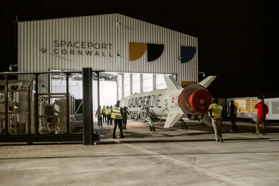 This undated photo provided by Virgin Orbit on Monday, Jan. 9, 2023, shows the LauncherOne rocket in a hanger at Spaceport Cornwall, at Cornwall Airport in Newquay, England. Engineers are making final preparations for the first satellite launch from the U.K. later Monday, when a repurposed passenger plane is expected to release a Virgin Orbit rocket carrying several small satellites into space.
