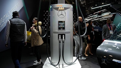 A ChargePoint electric vehicle charging hub, center, is on display at the Mercedes-Benz booth during the CES tech show Thursday, Jan. 5, 2023, in Las Vegas.