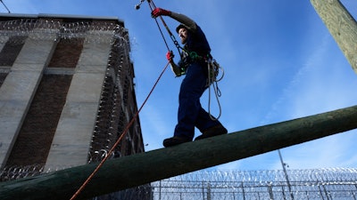 Prisoner Scott Steffes works on climbing at the Parnall Correctional Facility's Vocational Village in Jackson, Mich.