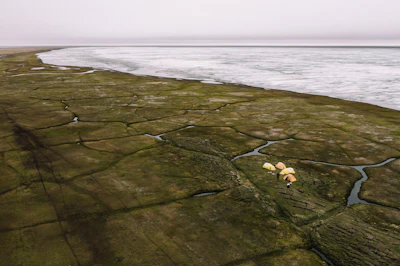 This Sunday, June 30, 2019, aerial photo released by Earthjustice shows the Alaska's North Slope in the Western Arctic on the edge of Teshekpuk Lake, Alaska.
