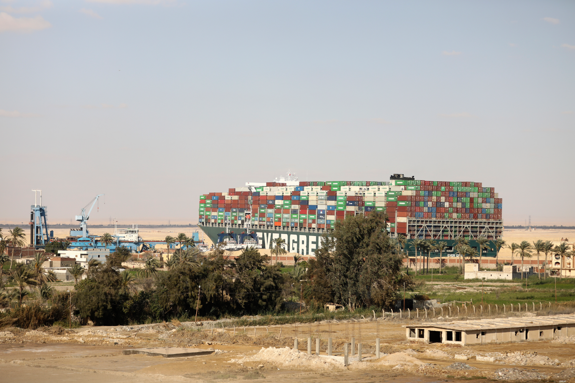 The Ever Given, a Panama-flagged cargo ship, is wedged across the Suez Canal, in Amer, Egypt, March 28, 2021.