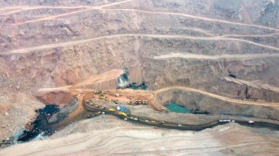 In this aerial photo released by China's Xinhua News Agency, rescuers work at the site of a collapsed open pit coal mine in Alxa League in northern China's Inner Mongolia Autonomous Region, Thursday, Feb. 23, 2023. An open pit mine collapsed in China's northern Inner Mongolia region on Wednesday, killing multiple people and leaving dozens more missing, state media reported.