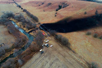 In this photo taken by a drone, cleanup continues in the area where the ruptured Keystone pipeline dumped oil into a creek in Washington County, Kan., on Dec. 9, 2022. A faulty weld at a bend in an oil pipeline contributed to a spill that dumped nearly 13,000 bathtubs' worth of crude oil into a northeastern Kansas creek, the pipeline's operator said Thursday, Feb. 9, 2023, estimating the cost of cleaning it up at $480 million.