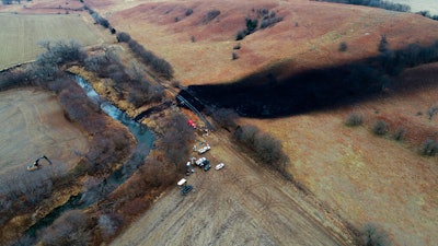 In this photo taken by a drone, cleanup continues in the area where the ruptured Keystone pipeline dumped oil into a creek in Washington County, Kan., on Dec. 9, 2022. A faulty weld at a bend in an oil pipeline contributed to a spill that dumped nearly 13,000 bathtubs' worth of crude oil into a northeastern Kansas creek, the pipeline's operator said Thursday, Feb. 9, 2023, estimating the cost of cleaning it up at $480 million.