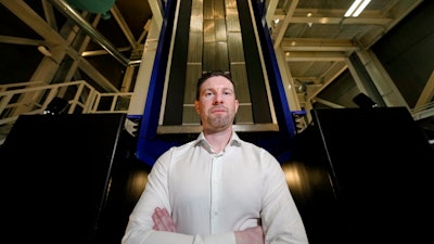 Last Energy CEO Bret Kugelmass poses in front a prototype reactor inside the company's demonstration unit on Tuesday, Jan. 17, 2023, in Brookshire, Texas. Kugelmass, a technology entrepreneur and mechanical engineer, said the 20-megawatt microreactors could replace carbon dioxide-emitting fossil fuels that power factories or data centers.