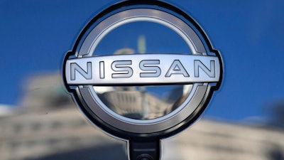 A Nissan logo is seen on a car at its showroom in Tokyo, Feb. 21, 2023. Nissan is recalling more than 809,000 small SUVs in the U.S. and Canada, Tuesday, Feb. 28, because a key problem can cause the ignition to shut off while they’re being driven. The recall covers Rogues from the 2014 through 2020 model years, as well as Rogue Sports from 2017 through 2022.