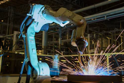 Robot Welding In An Auto Factory