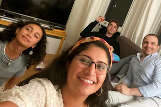 This image provided by Catalina María Gomez Caycedo shows Aleena Rupani, from left, Catalina María Gomez Caycedo, Henry Crabtree, and Michael Watkins in Crabtree's London flat. The close friends met through their work at a software company with workers scattered around the globe. A recent Gallup survey says just 2 in 10 adult U.S. employees say they have a best friend at work.