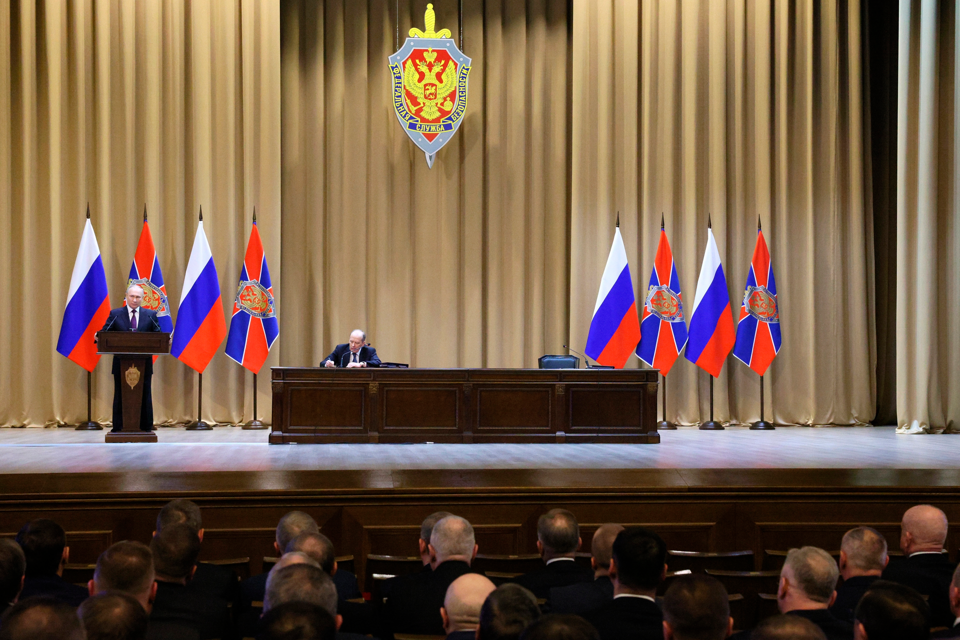 Russian President Vladimir Putin delivers his speech during a meeting of the Federal Security Service (FSB) board as Federal Security Service (FSB) director Alexander Bortnikov sits next in Moscow, Russia, Tuesday, Feb. 28, 2023.