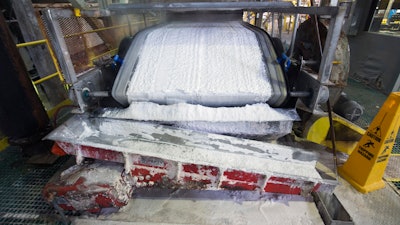 Technical grade lithium carbonate comes off a conveyor belt during a tour of the Silver Peak lithium mine on Jan. 30, 2017, near Tonopah, Nev.