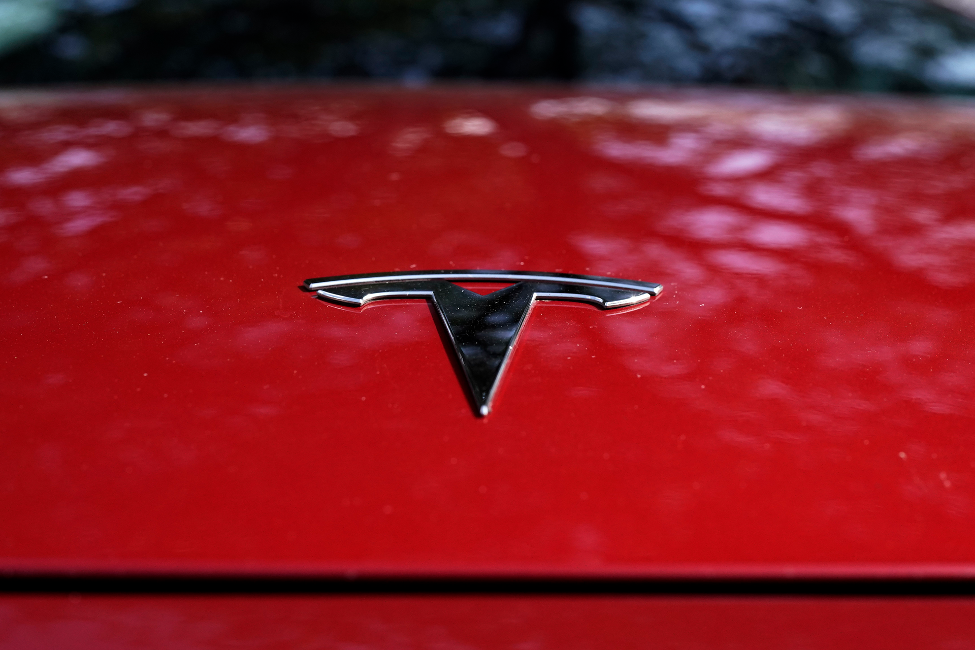 A Tesla logo is seen on a vehicle on display in Austin, Texas, Wednesday, Feb. 22, 2023.