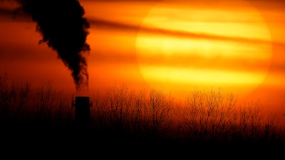 Emissions from a coal-fired power plant, Kansas City, Mo., Feb. 1, 2021.