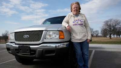 Carol Rice stands with her recently-purchased 2003 Ford Ranger Wednesday, March 15, 2023, in Shawnee, Kan.