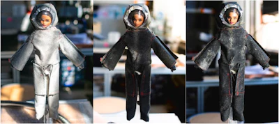 1/6-scale astronaut after dust application (left); after dust application and treatment in a vacuum (center); after dust application, treatment in a vacuum, and spot treatment with a handheld liquid cryogen spray (right).
