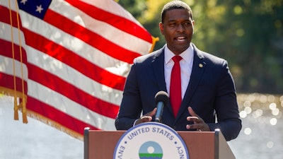 Michael Regan, the head of the Environmental Protection Agency, announces the Biden administration is launching a broad strategy to regulate toxic industrial compounds associated with serious health conditions that are used in products ranging from cookware to carpets and firefighting foams during an event at N.C. State University, Oct. 18, 2021, in Raleigh, N.C. The EPA on Tuesday, March 14, 2023, proposed limiting the amount of harmful “forever chemicals” in drinking water to the lowest level that tests can detect.