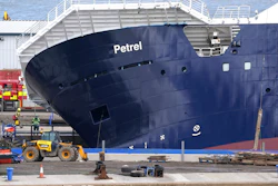 Emergency services work at Imperial Dock, where a ship has become dislodged from its holding and is partially toppled over, in Leith, Edinburgh, Scotland, Wednesday March 22, 2023.
