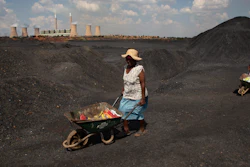 Women push wheelbarrows atop a coal mine dump at the coal-powered Duvha power station, near Emalahleni east of Johannesburg, Nov. 17, 2022. Humanity still has a chance, close to the last one, to prevent the worst of climate change’s future harms, a top United Nations panel of scientists said Monday, March 20, 2023. But doing so requires quickly slashing carbon pollution and fossil fuel use.