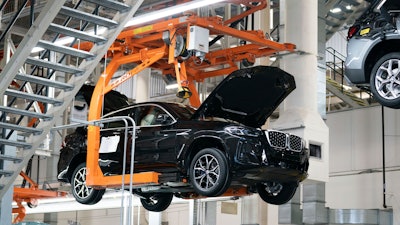 Cars move on the assembly line at the BMW Spartanburg plant in Greer, S.C., Wednesday, October 19, 2022.