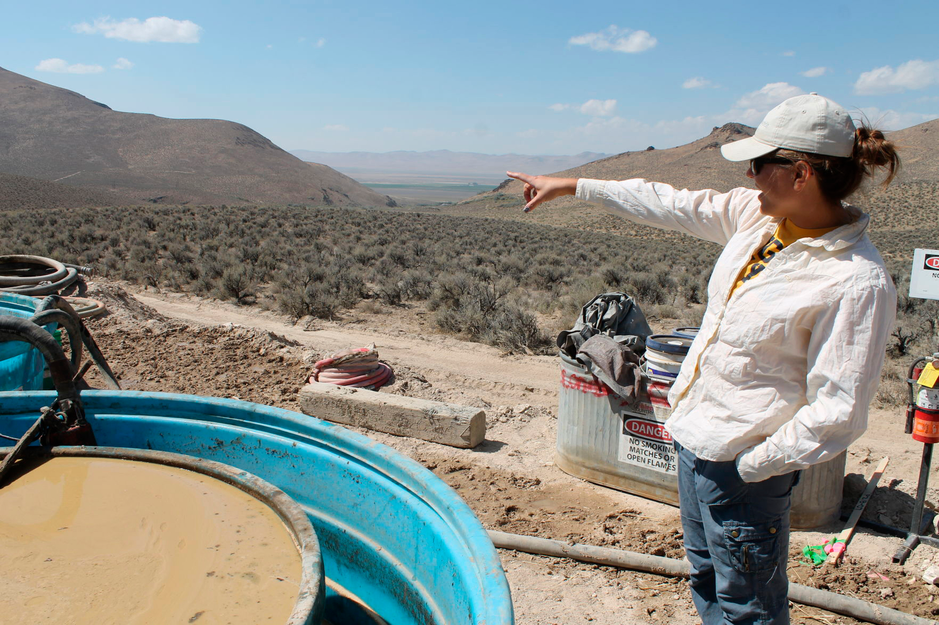 Melissa Boerst, a Lithium Nevada Corp. geologist, points to an area of future exploration from a drill site at the Thacker Pass Project in Humboldt County, Nev., Sept. 13, 2018.