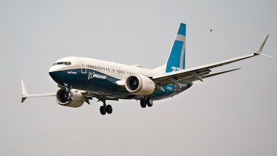 In this Wednesday, Sept. 30, 2020, file photo, a Boeing 737 Max jet, piloted by Federal Aviation Administration Chief Steve Dickson, prepares to land at Boeing Field following a test flight in Seattle.