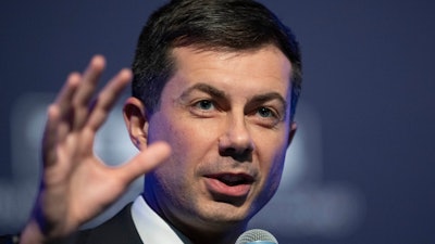 Transportation Secretary Pete Buttigieg speaks to the Transportation Research Board gathering in Washington on Jan. 11, 2023.