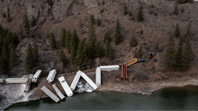 A train sits derailed near Quinn's Hot Springs Resort west of St. Regis, Mont., Sunday, April 2, 2023.