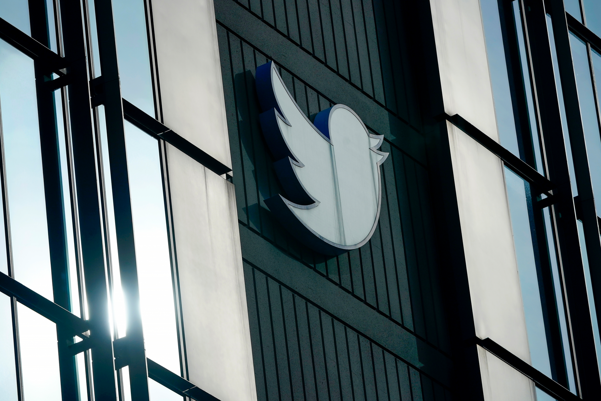 A Twitter logo hangs outside the company's offices in San Francisco, Dec. 19, 2022. Elon Musk said Thursday, May 11, 2023, that he has found a new CEO for Twitter, or X Corp. as it is now called.
