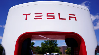 A Tesla Supercharger is seen at Willow Festival shopping plaza parking lot, Aug. 10, 2022, in Northbrook, Ill.