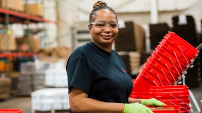 This photo provided by Towards Employment shows Mary Lamar working at Talan Products in Cleveland in 2023.