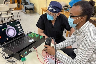 Doctors practicing imaging using the model eye on-site in Haiti.